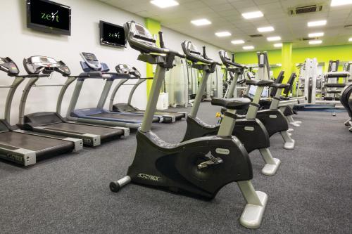 a gym with several tread machines in a row at The Killeshin Hotel Portlaoise in Portlaoise