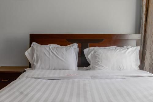 Ένα ή περισσότερα κρεβάτια σε δωμάτιο στο Vinetea Hotel