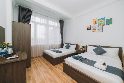 Postel nebo postele na pokoji v ubytování AN TÂM House Đà Lạt