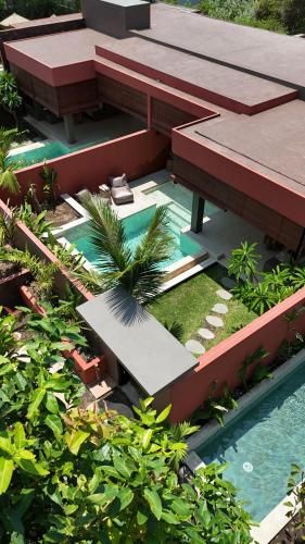 an aerial view of a resort with a swimming pool at Lasai Villas in Gili Air