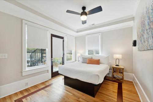 a bedroom with a bed and a ceiling fan at Downtown 3 Bedroom with Tons of Natural Light in Charleston