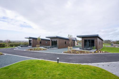 a couple of buildings on a road at Cefni Lodge in Llangefni
