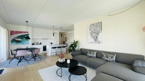 a living room with a couch and a table at ApartmentInCopenhagen Apartment 1566 in Copenhagen