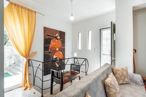 a living room with a couch and a chair at Niki's House in Gournes