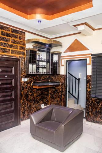 a lobby with a large leather ottoman in the middle at 2 bed room apartment in Port Harcourt