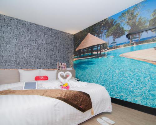 a bedroom with a bed and a swimming pool at Hsinchu 101 Inn in Hsinchu City