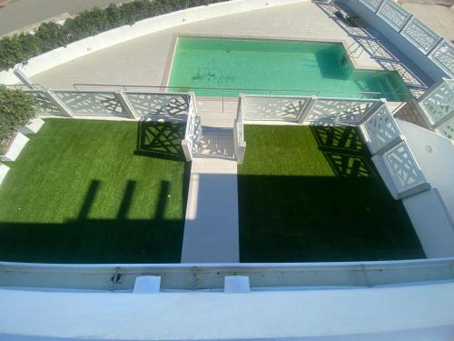 an overhead view of a stadium with green grass at Aqualife luxury home 4 in Arzachena