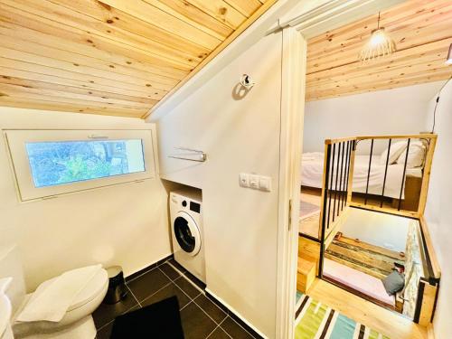 a tiny house with a bathroom and a toilet at Balloon Boutique House, City Centre in Plovdiv
