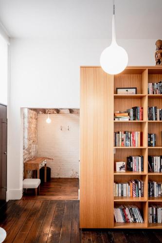 a room with a book shelf with books at Inner-city sanctuary with off-street parking in Hobart