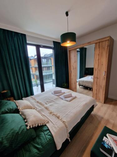 Katil atau katil-katil dalam bilik di Apartament Zielony 36 Laguna Beskidów "prywatna komórka"