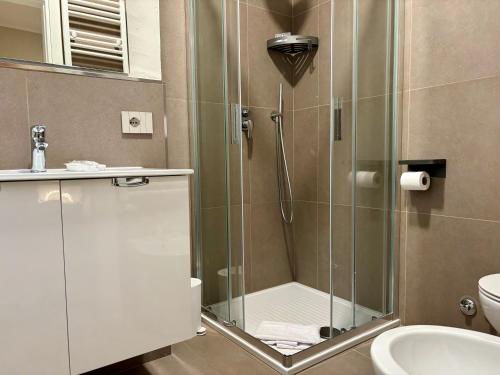 a bathroom with a shower with a glass door at Camere di Bianca in Foligno