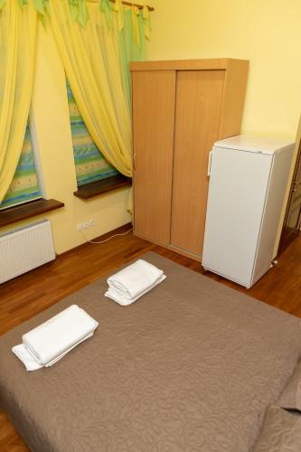 Postel nebo postele na pokoji v ubytování Kohavi Cottages