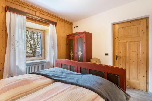 Postel nebo postele na pokoji v ubytování Ciasa Majonade Pozza di Fassa tipo2
