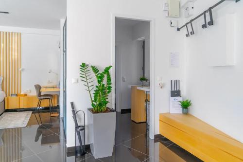 a living room with a table and a desk at The HostMaster Urban Bliss in Athens