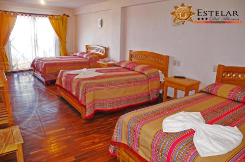 Кровать или кровати в номере HOTEL ESTELAR del TITICACA