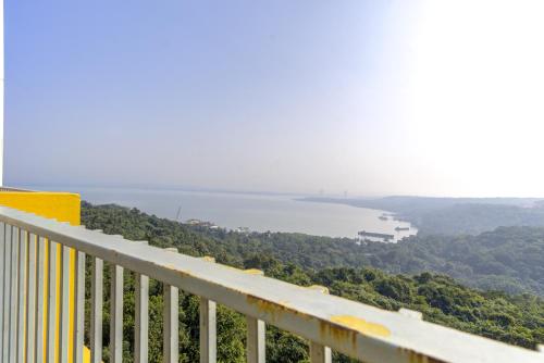 a view of the water from a balcony of a building at Greenspace 2BHK with resort style amenities in Vasco Da Gama