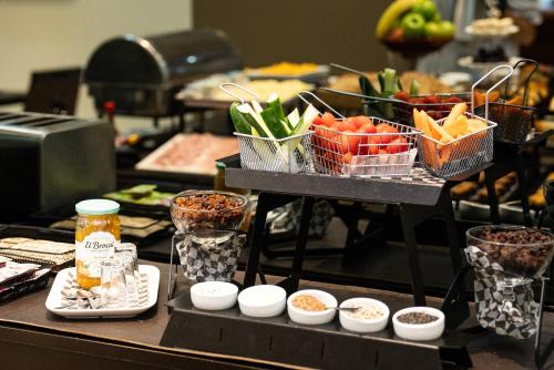 a buffet with vegetables in baskets on a table at Blank Hotel Recoleta in Buenos Aires