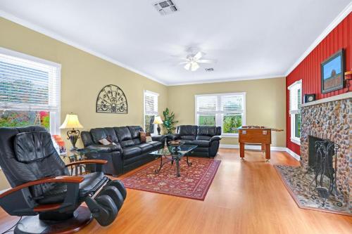 a living room with a couch and a fireplace at Lighthouse Hill Ranch - Brown House in Johnson City