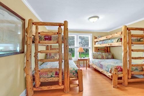 two bunk beds in a room with a bed at Lighthouse Hill Ranch - Brown House in Johnson City