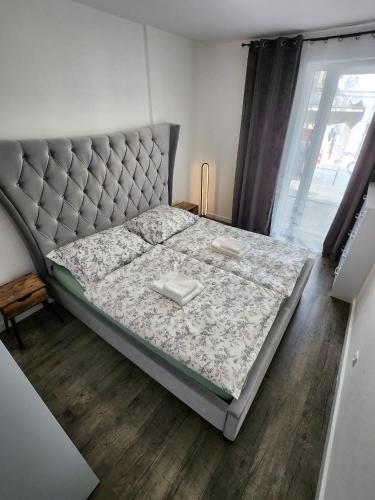 a bed in a room with a mattress and a window at Apartman - Centrum in Bratislava