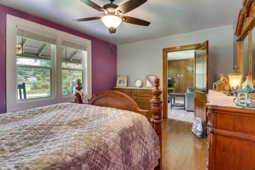 a bedroom with a bed and a ceiling fan at Pet-Friendly Cashiers Cabin Fire Pit, Near Lakes! in Cashiers