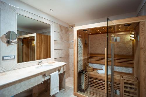 a bathroom with a shower and a sink at Delta Hotels by Marriott Olbia Sardinia in Olbia