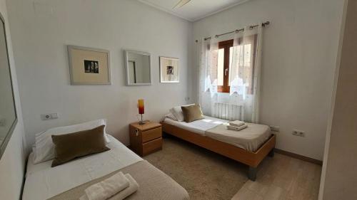 a bedroom with two beds and a window at Beautiful 2 bed apartment at El Valle Golf AA412EV in Murcia