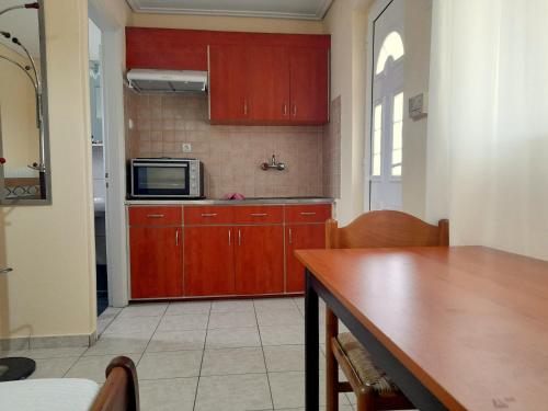 Kuchyň nebo kuchyňský kout v ubytování Απεριόριστη θέα