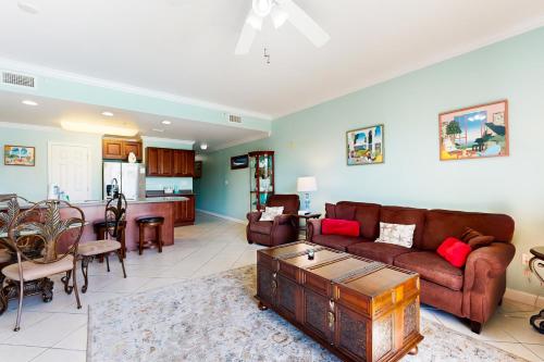 a living room with a couch and a table at Beach Resort 210 in Destin