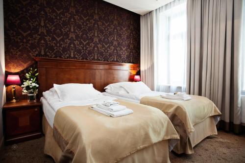 Posteľ alebo postele v izbe v ubytovaní Hotel Akvilon