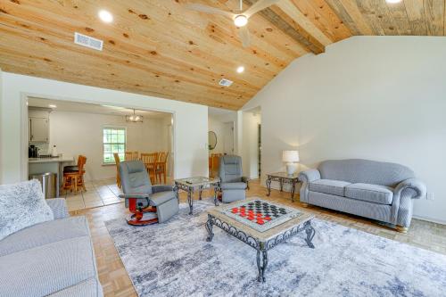 a living room with a couch and a table at Perry Family Home on 2 Acres with Private Pool in Perry