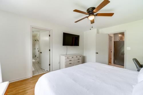 a bedroom with a white bed and a ceiling fan at Perry Family Home on 2 Acres with Private Pool in Perry