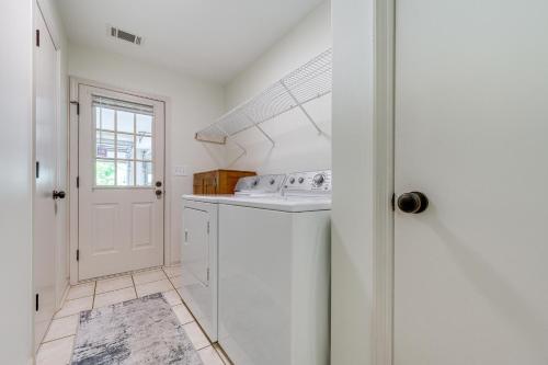 a white laundry room with a washer and dryer at Perry Family Home on 2 Acres with Private Pool in Perry
