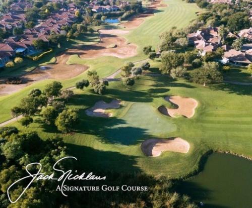 an aerial view of a golf course at Lovely Family Home / Pecanwood Golf Estate in Hartbeespoort