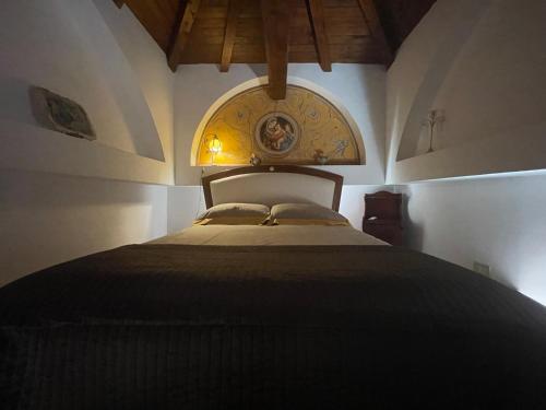 En eller flere senge i et værelse på Attico Le Castelline