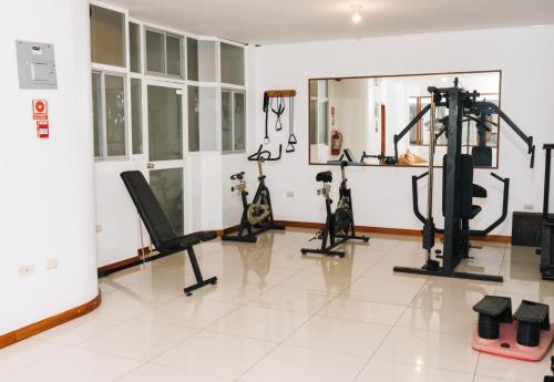 a gym with several exercise equipment in a room at El Descanso del Guia in Puerto Ayora