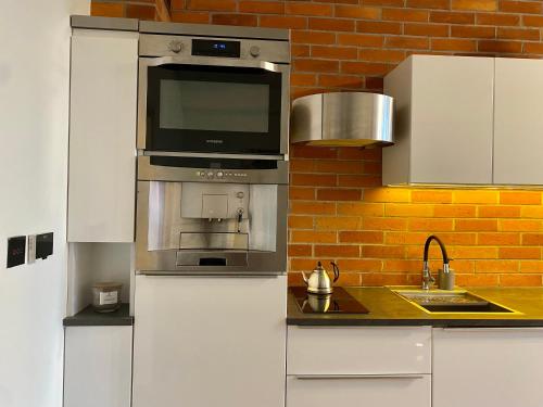 Virtuvė arba virtuvėlė apgyvendinimo įstaigoje Salwator Apartment - Topolove Rooms & Apartments