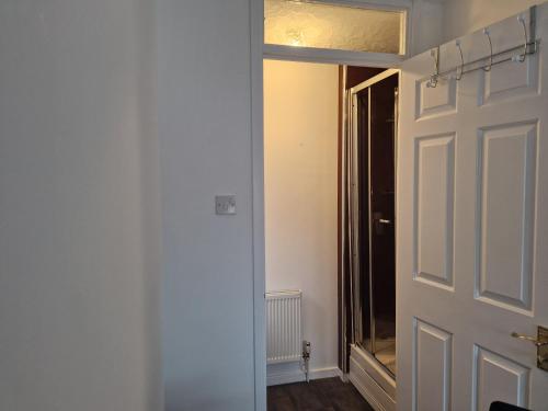 an open door to a room with a hallway at Captivating 3-Bed House in Strood Rochester Kent in Rochester