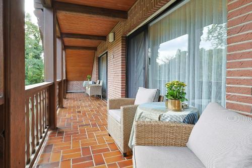 Ein Sitzbereich in der Unterkunft Jagdhaus zu Amtern Apartment Rose
