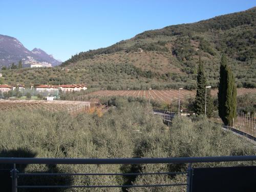 a view of a mountain with a train on the tracks at Ecohotel Primavera in Riva del Garda