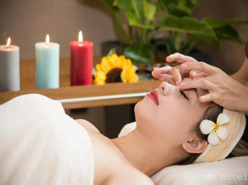 a woman getting a massage at a spa at Minh Minh Hotel & Spa in Da Nang