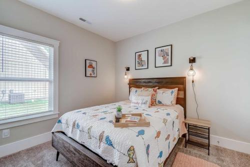 a bedroom with a bed with a tray on it at New Tucked Away Quiet Beach Haven in Little River