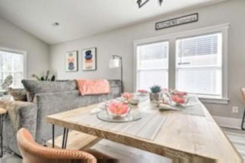 a living room with a table and a couch at New Tucked Away Quiet Beach Haven in Little River