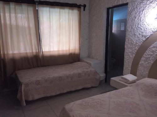 Postel nebo postele na pokoji v ubytování Villa Las Garzas