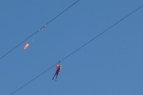 a person on a rope with a kite in the sky at Le cheval blanc E7 in Valmorel