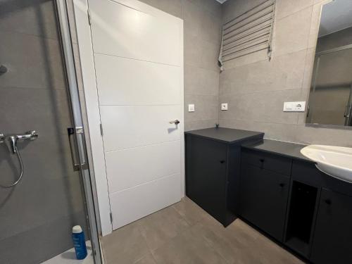 a bathroom with a shower and a sink at A Terraza By Oktheway in Laxe