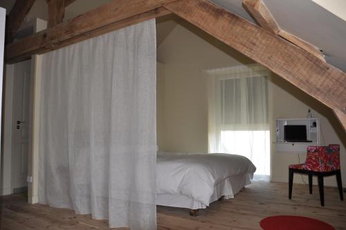 Postel nebo postele na pokoji v ubytování Le Mas Capel