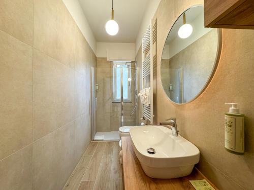 a bathroom with a sink and a mirror at Tenuta dei Normanni in Salerno