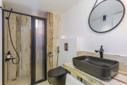 a bathroom with a sink and a mirror at Alice 2-BR in Mar Mikhael in Beirut