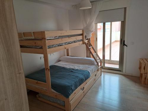 a couple of bunk beds in a room at Apartamento Cedeira in Cedeira